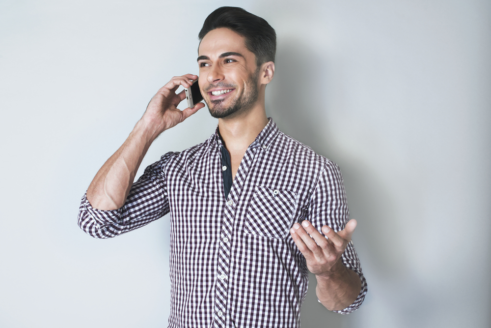 Photo of man on phone with customer