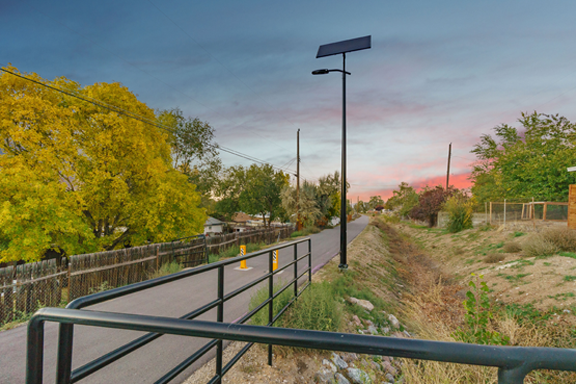 Solar-powered streetlight illuminating a pedestrian pathway and greenway in South Carolina, supporting safe and sustainable community spaces.