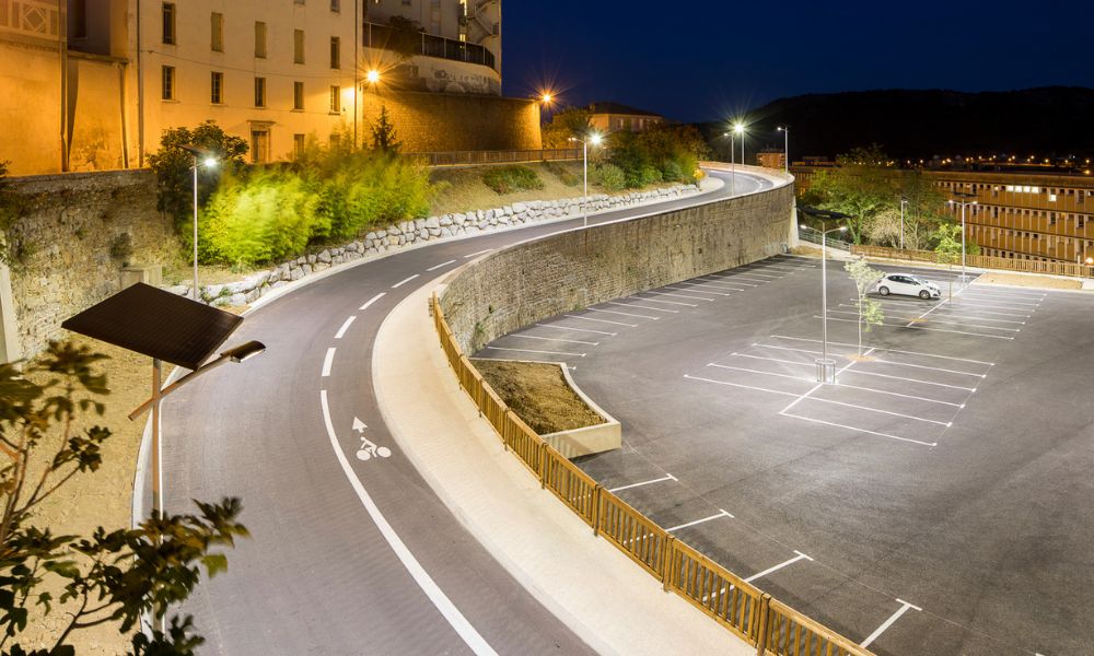 Fonroche solar lighting illuminating a parking area at night, enhancing safety and walkability without grid