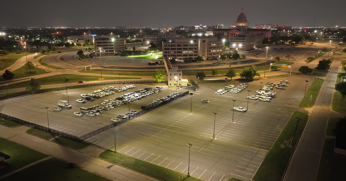 Fonroche solar lighting illuminating a parking lot at night with uniform, off-grid LED light for enhanced safety and visibility.