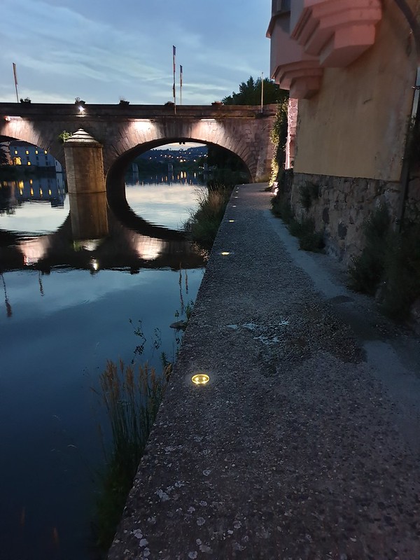 Crystal Stud solar lights embedded along a riverside walkway at dusk, providing discreet, low-glare illumination for enhanced pedestrian safety and architectural ambiance.