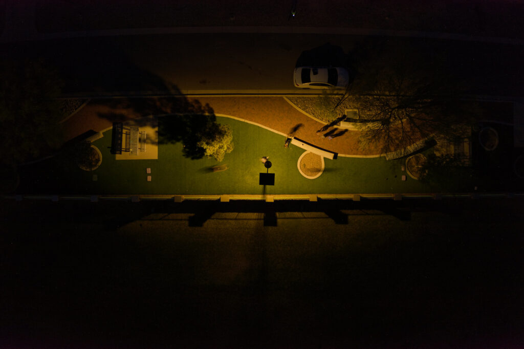 Solar-powered street lights in a suburban area, providing sustainable and reliable lighting.