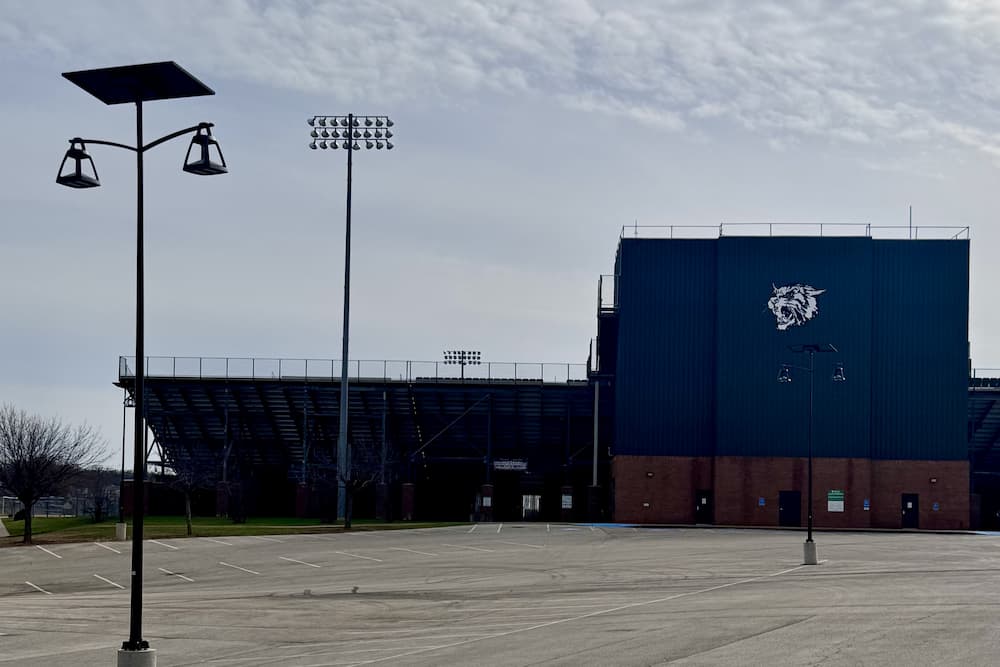 Texas ISD parking lot during twilight, prepped for solar lighting installation.