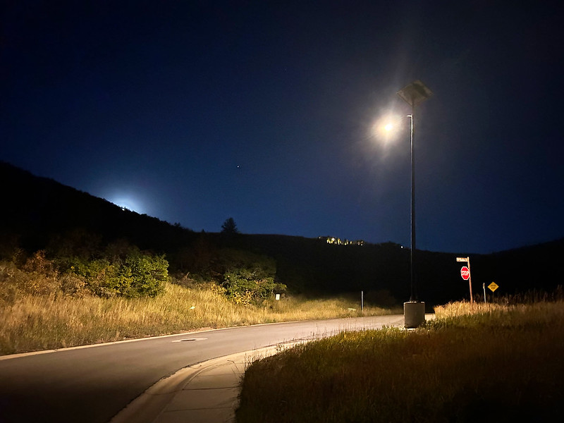 essential-solar-street-light-rural-road Solar streetlight illuminating a rural roadway at night