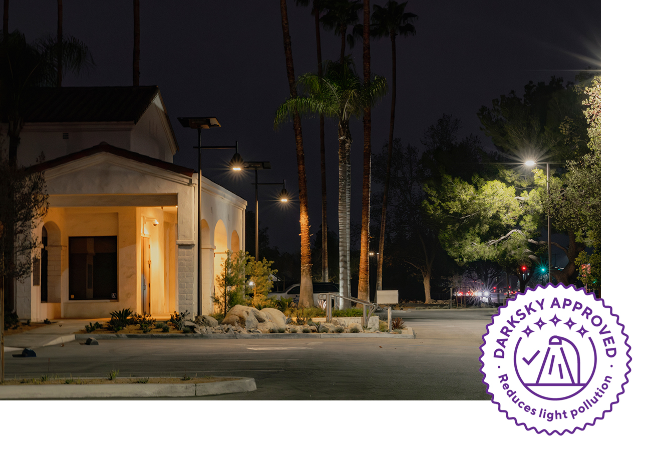 parking-lot-solar-lighting-darksky-approved Dark Sky compliant solar parking lot lighting illuminating a commercial property at night