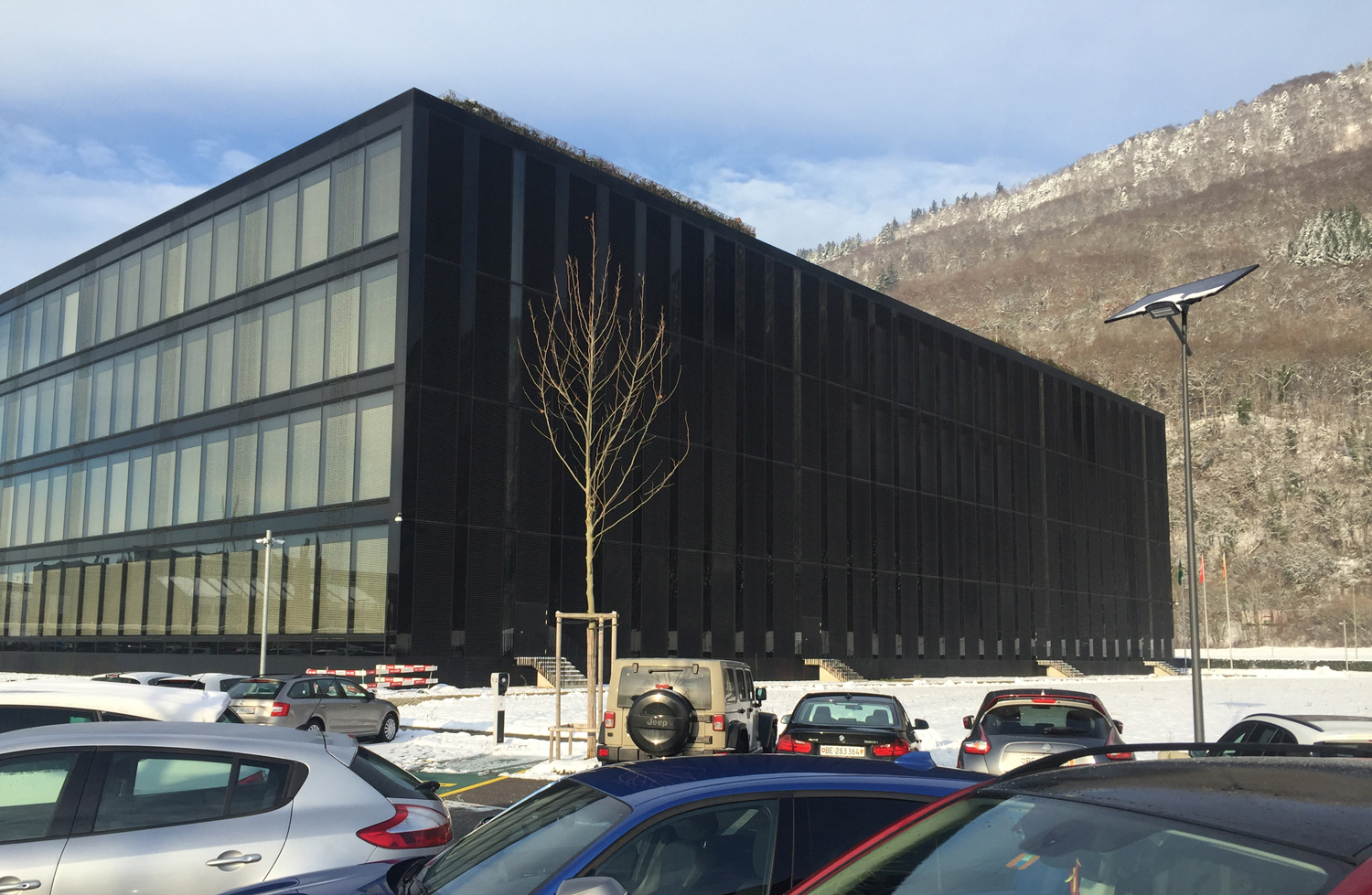essential-solar-smartlights-parking-lot Solar parking lot lighting installed outside a commercial office building