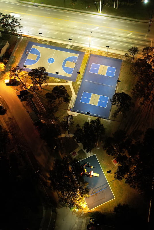 basketball and pickle ball court being lit by fonroche solar street lights