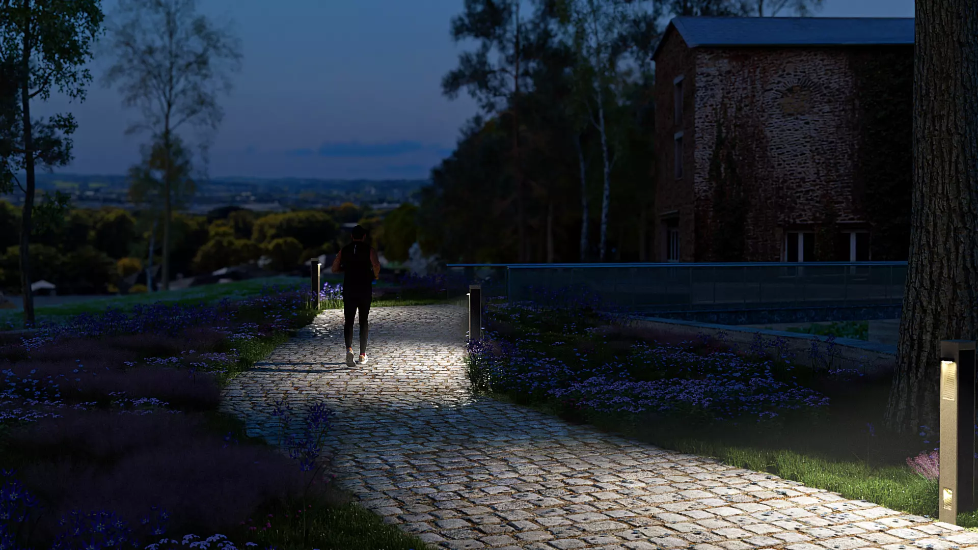 NOWATT BRUT solar bollard casting warm light on a cobblestone path at night, blending modern off-grid lighting with natural materials for scenic pedestrian routes.