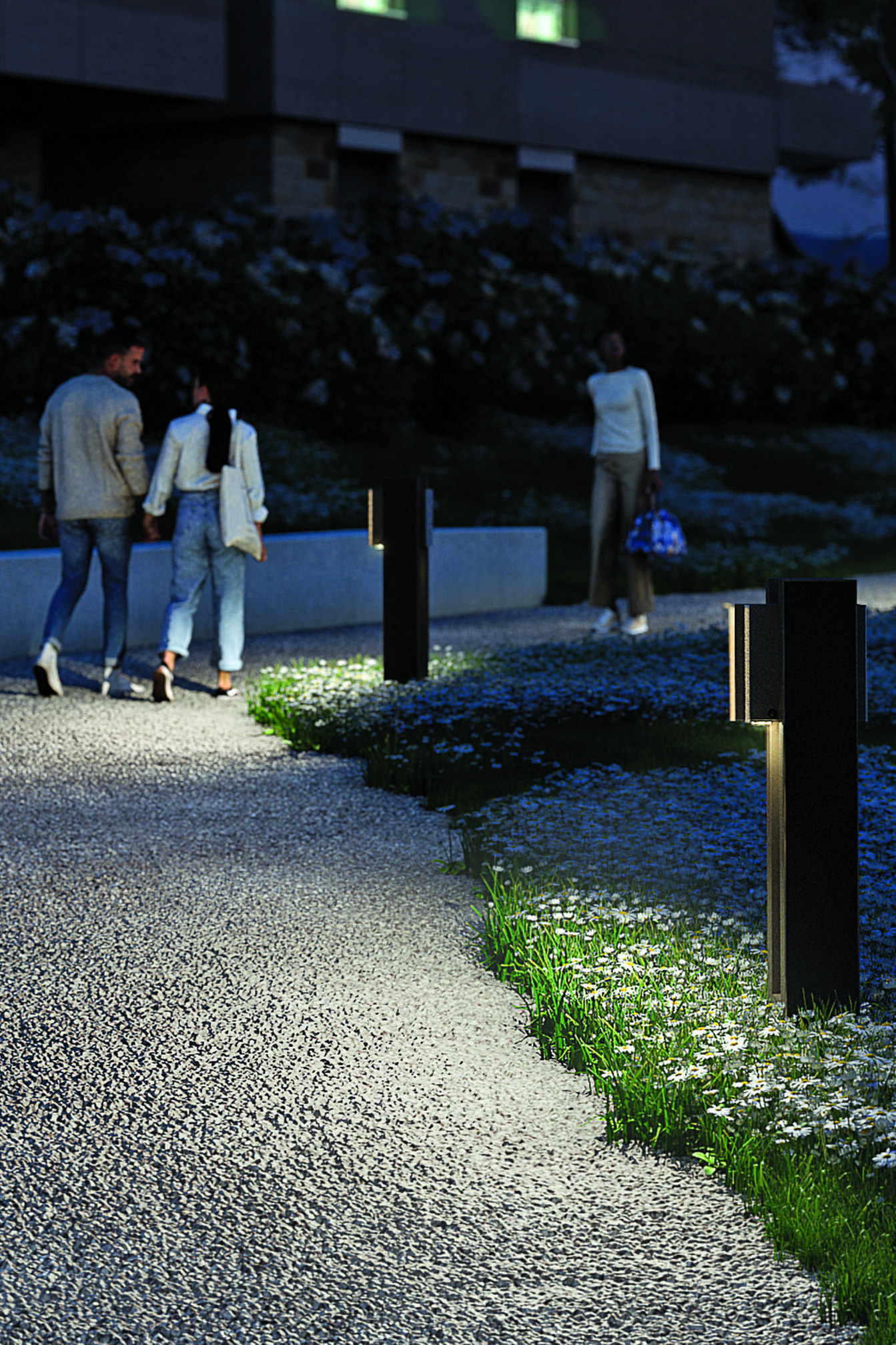 Solar bollard lighting illuminating a pedestrian pathway to improve nighttime safety and visibility.