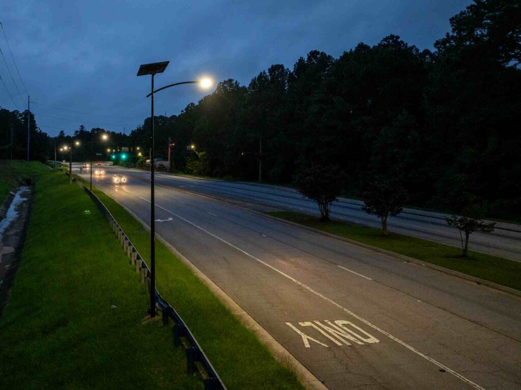 Solar streetlights illuminating a Georgia roadway at dusk, providing reliable off-grid lighting for safe and sustainable transportation.