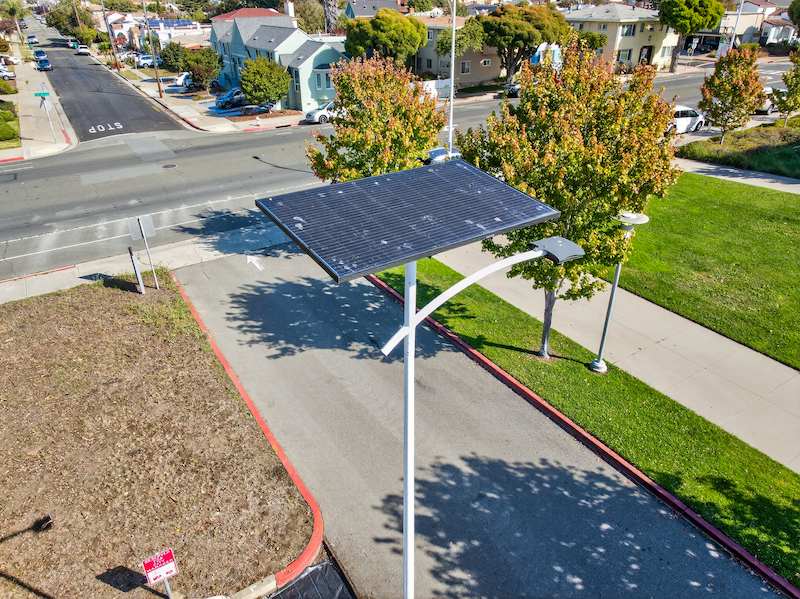 A Fonroche off-grid solar streetlight installed along a community roadway, ideal for urban development and mixed-use projects in Georgia.