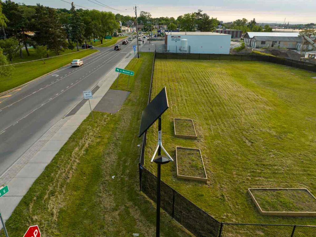 Solar-powered streetlight installed along a community road in South Carolina, showing clean and accessible infrastructure without trenching or wiring.