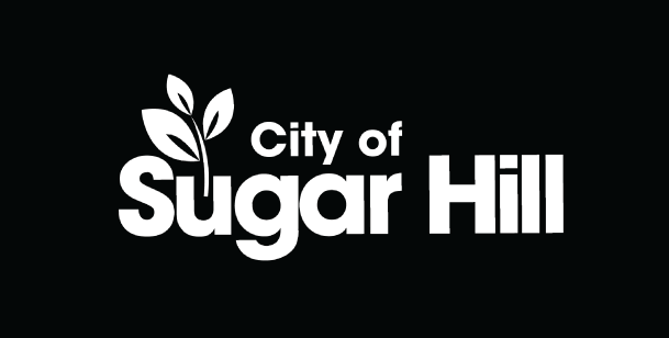 City of Sugar Hill logo with stylized leaf icon and text on a dark background