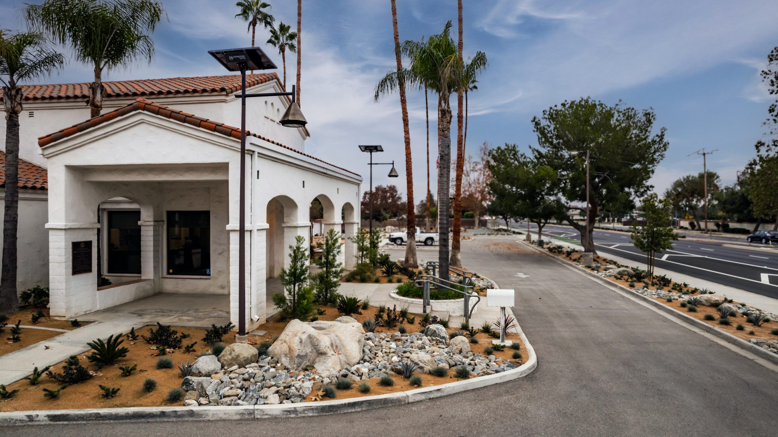 opera-solar-street-light-residential-area Solar-powered decorative street lights illuminating a residential leasing office and community amenities with energy-efficient outdoor lighting.