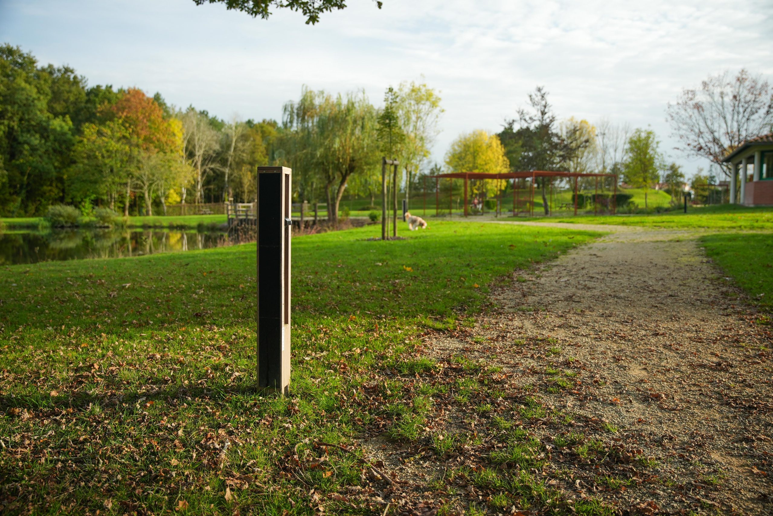 Solar-powered pathway bollard lighting installed in a tribal park and community gathering space with sustainable outdoor illumination for trails and cultural grounds.