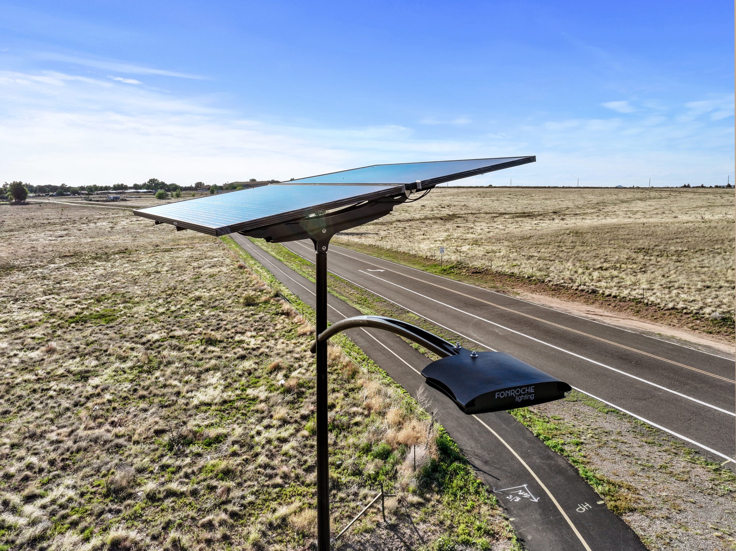 Arizona solar street lighting system illuminating a desert roadway with autonomous, grid-free LED lighting designed for extreme heat and dust.