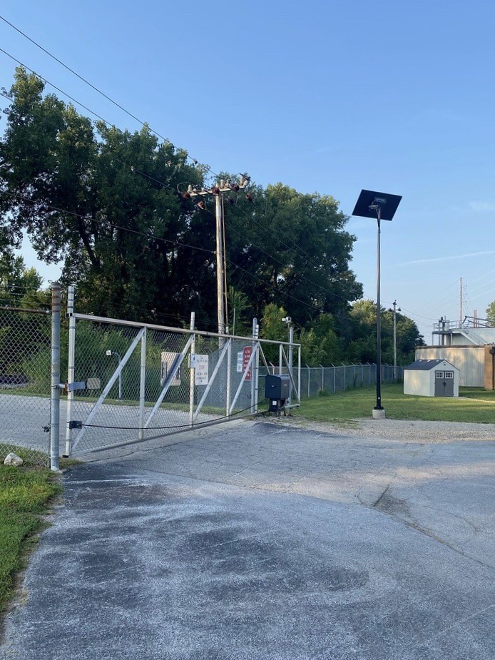 essential-military-security-zone Solar-powered roadway lighting installed along a secure perimeter roadway with off-grid street lights designed for military bases, federal facilities, and security zones.