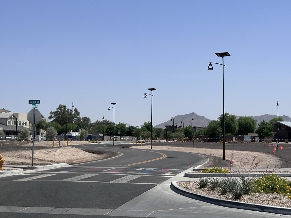 belle-epoque-commercial-development Solar-powered street lighting installed outside a commercial property and business campus, enhancing pedestrian safety, visibility, and aesthetics with autonomous off-grid lighting solutions.