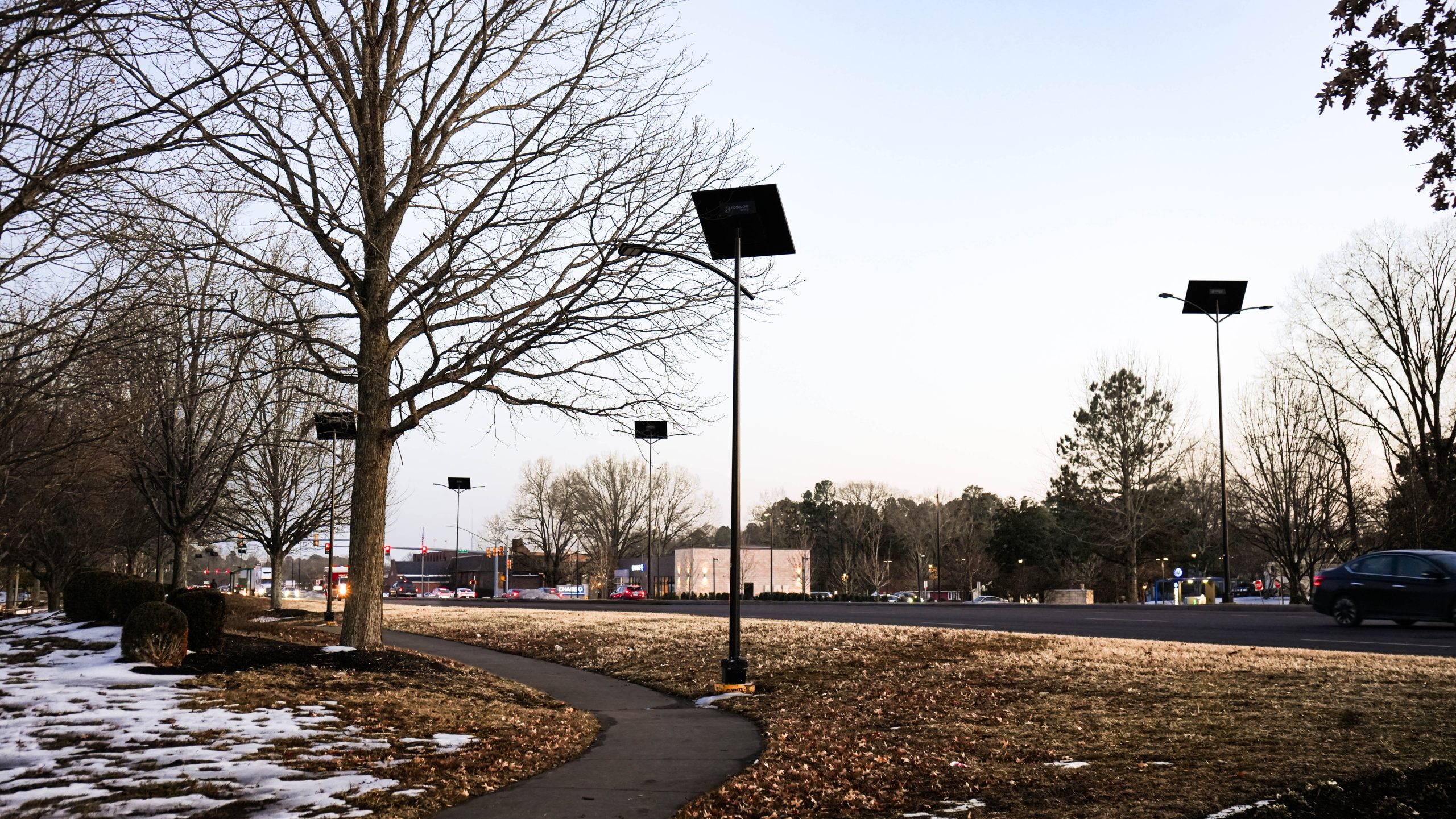 Solar-powered roadway lighting illuminating a school route and pedestrian corridor at night with off-grid street lights designed for safer student travel and improved visibility.