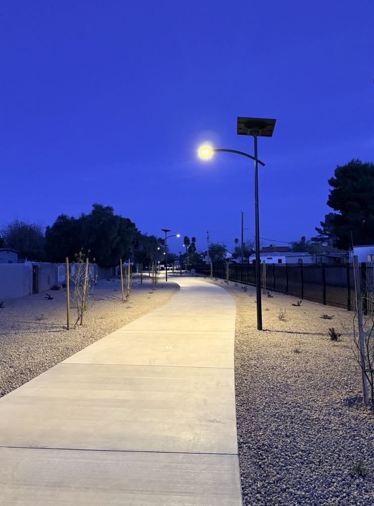 Solar-powered emergency roadway lighting illuminating an intersection at night with off-grid street lights designed for disaster response, emergency access, and public safety.