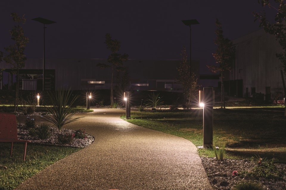 Solar bollard lighting installed along a landscaped pedestrian pathway