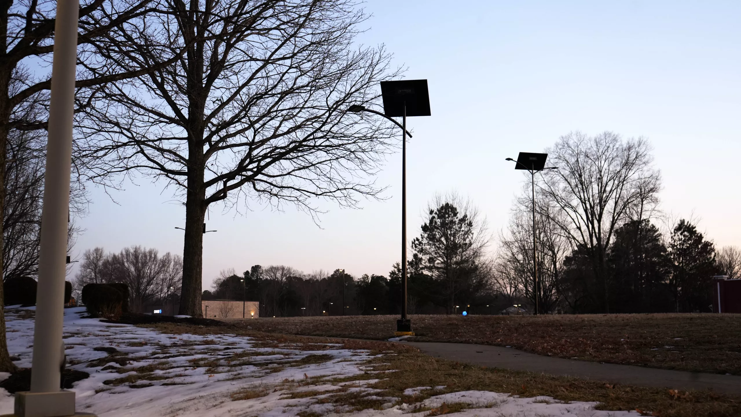 Off-grid solar street lights illuminating a pedestrian pathway in Virginia with autonomous solar-powered LED lighting for parks, campuses, municipalities, and public infrastructure.