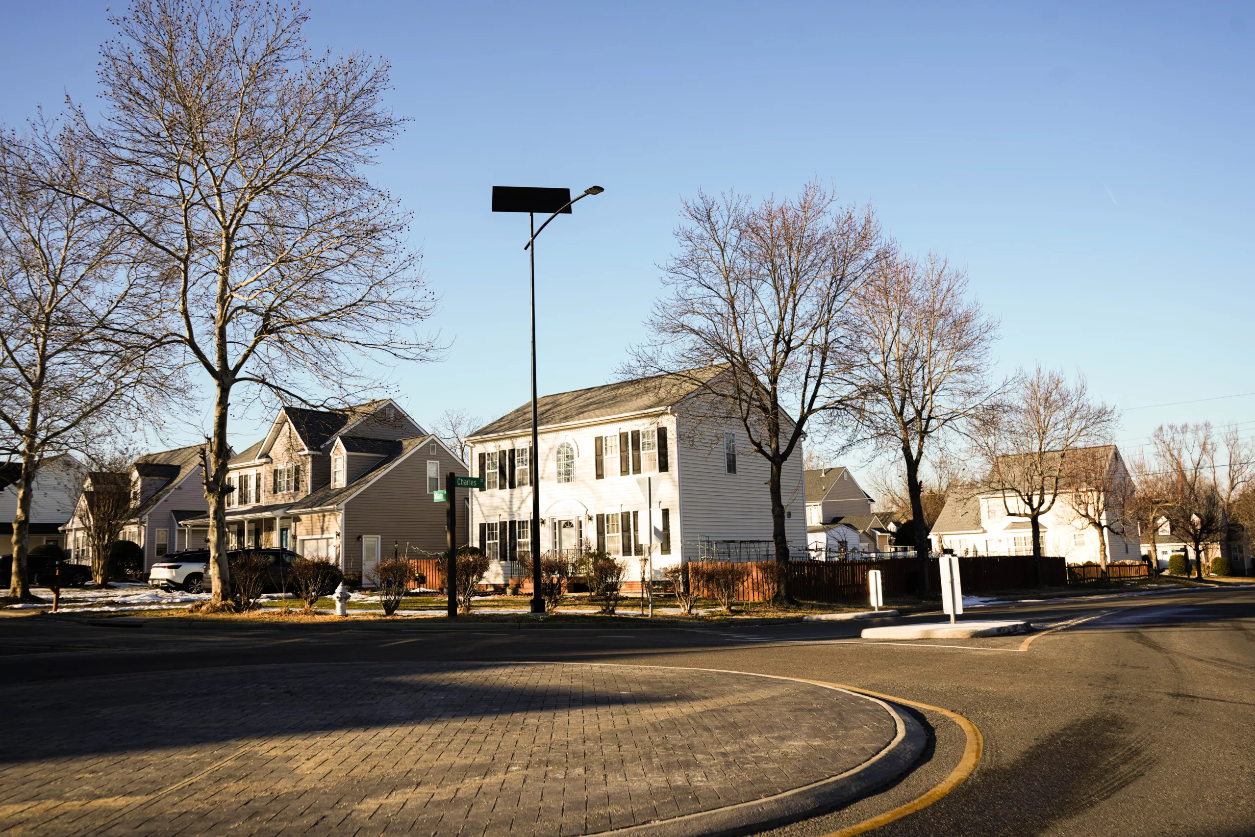 Autonomous solar street light illuminating a residential intersection in Virginia, providing off-grid LED lighting for neighborhoods and community roadways.