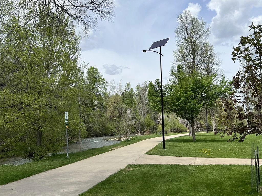 Off-grid solar street light illuminating a park pathway in Virginia, providing reliable Power 365 lighting for year-round public safety.