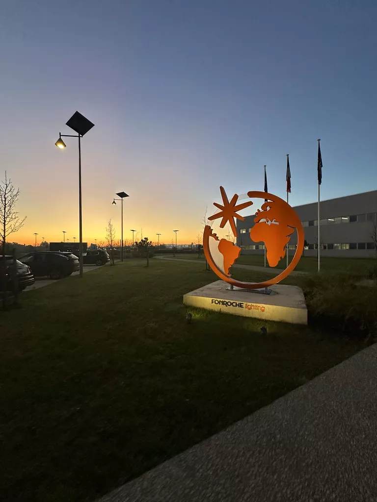 fonroche-lighting-america-smartlights-headquarters-solar-lighting.jpg Fonroche Lighting America SmartLights installation and illuminated company monument at the headquarters campus during sunset.