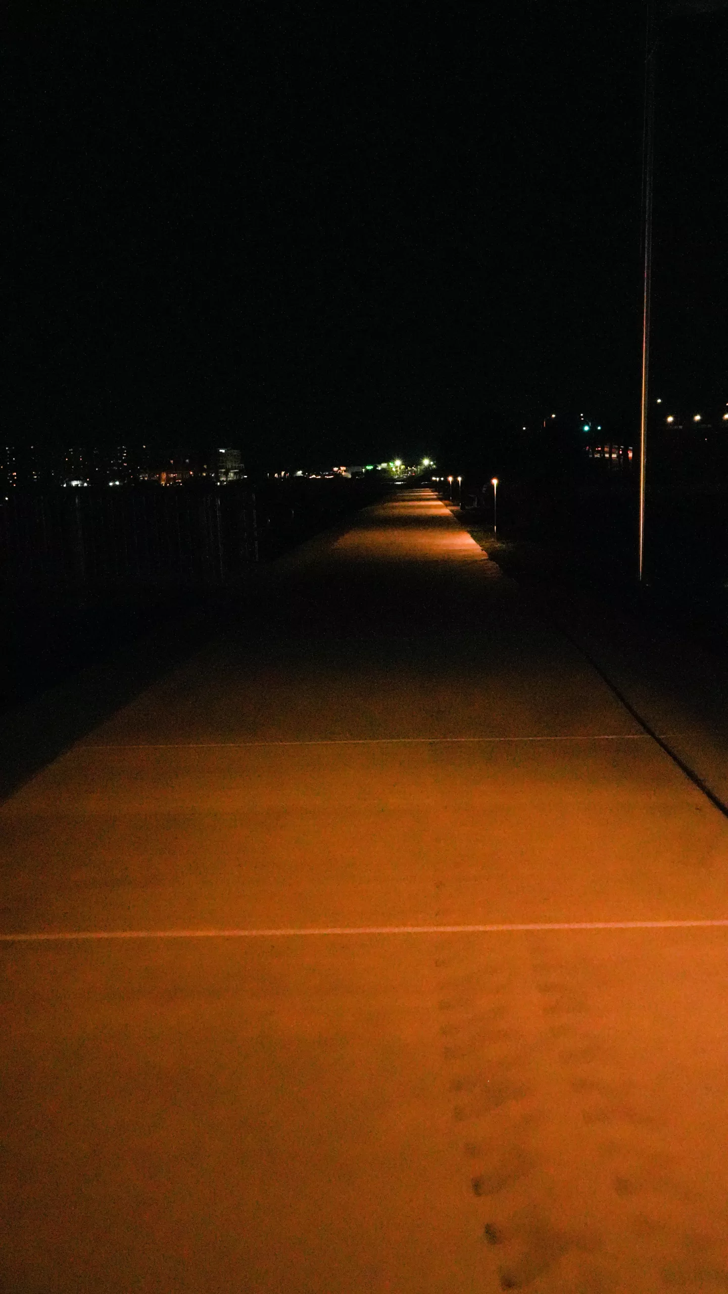 NOWATT BRUT solar bollards providing nighttime illumination along the Patriot Park Seawall walkway in Madeira Beach, Florida.