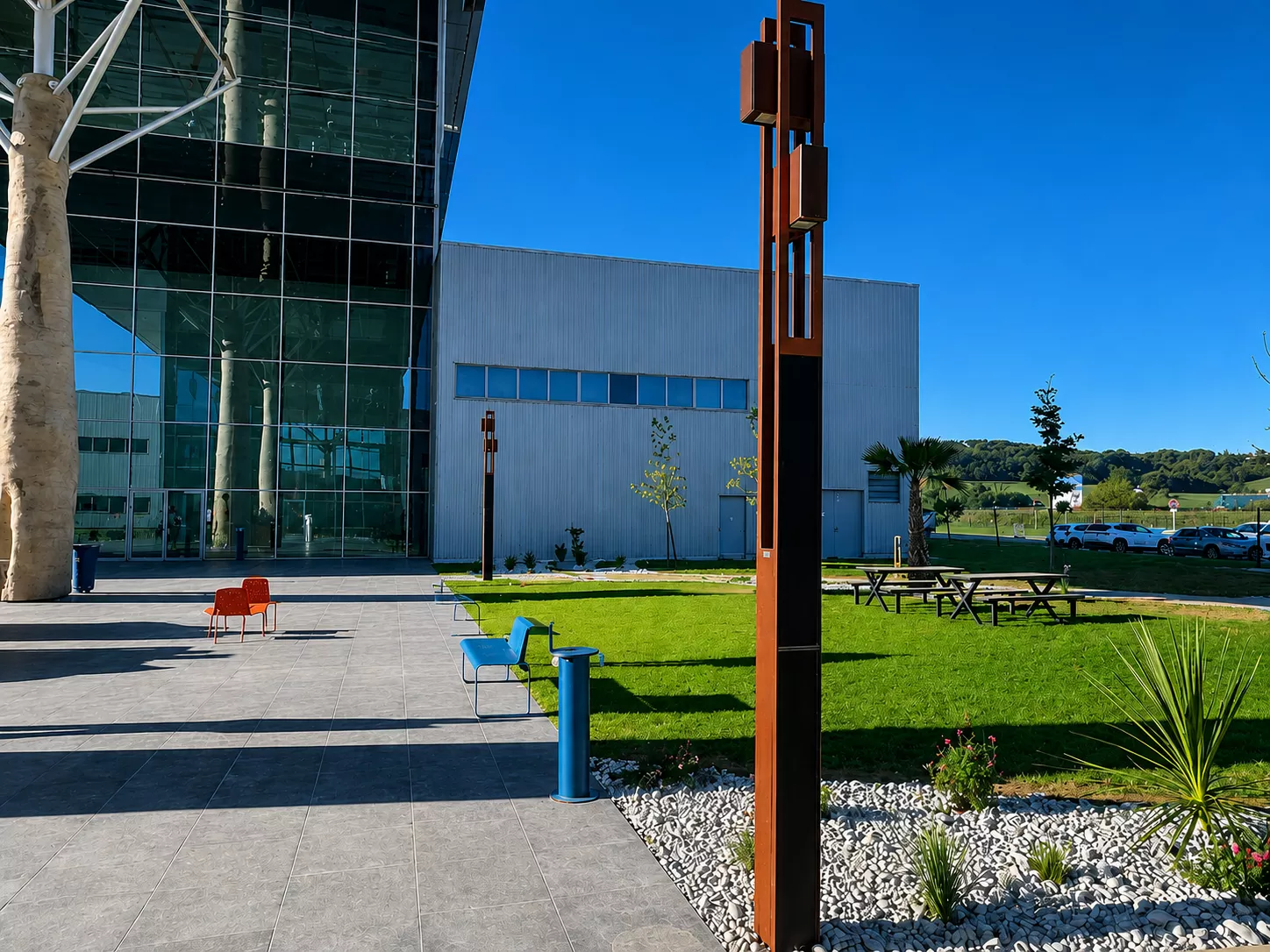 NOWATT FOLLOW UP solar pathway light installed outside a commercial campus to provide autonomous pedestrian lighting.