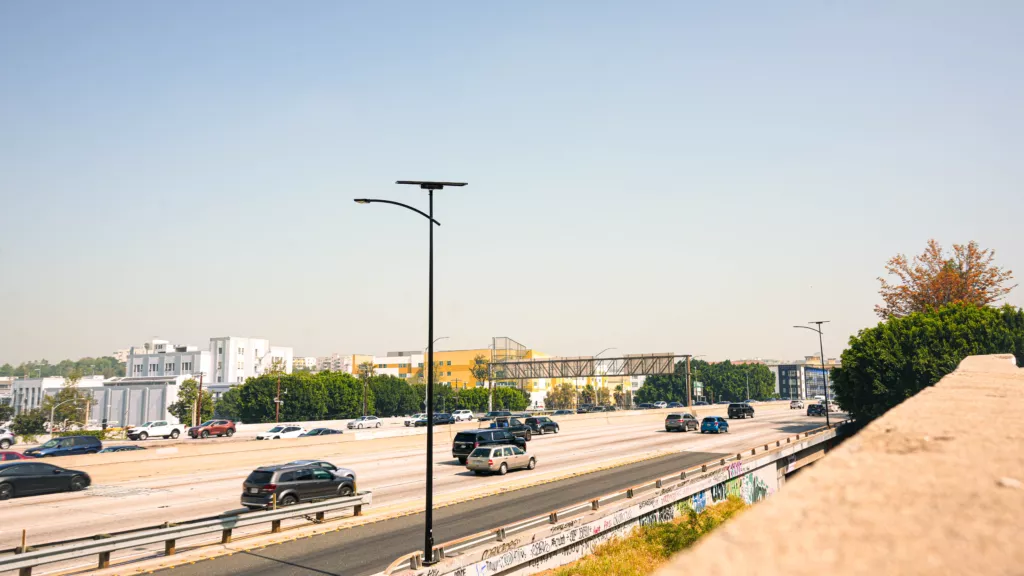 Autonomous solar street lights illuminating a California highway to improve roadway safety and support resilient transportation infrastructure.