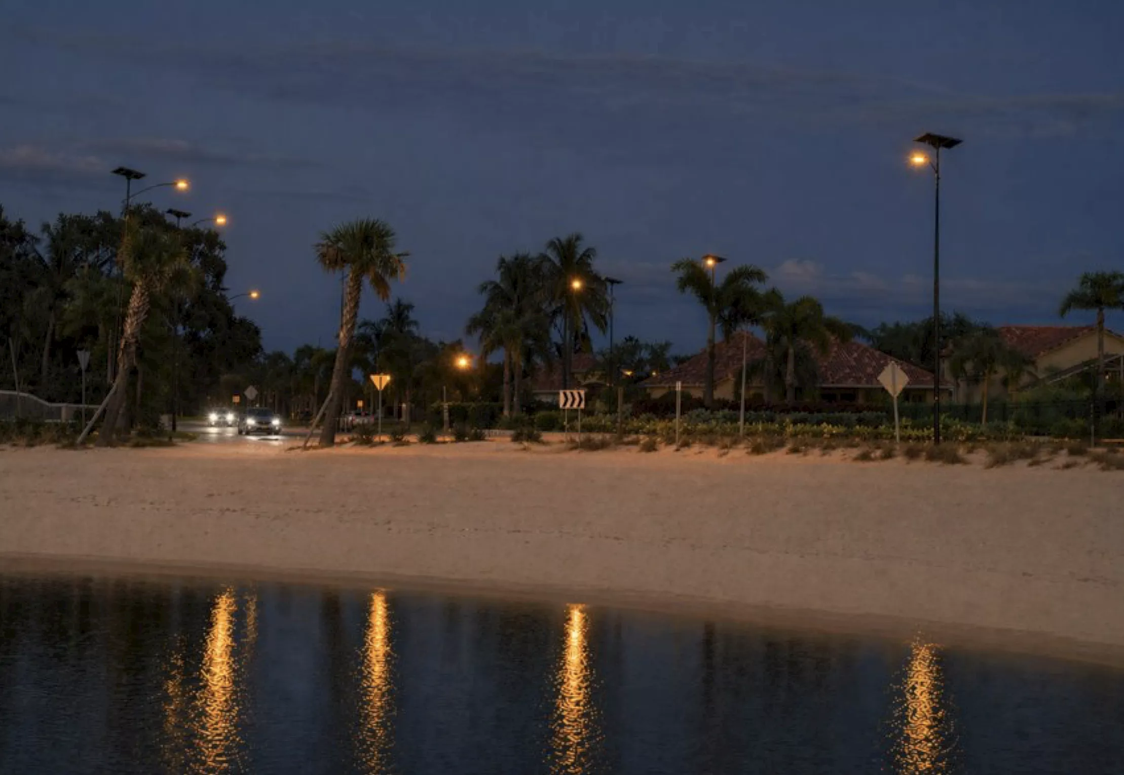 essential-road-street-amber-lighting Solar-powered street light with integrated photovoltaic panel installed in Florida, designed for hurricane-resistant, off-grid outdoor lighting.
