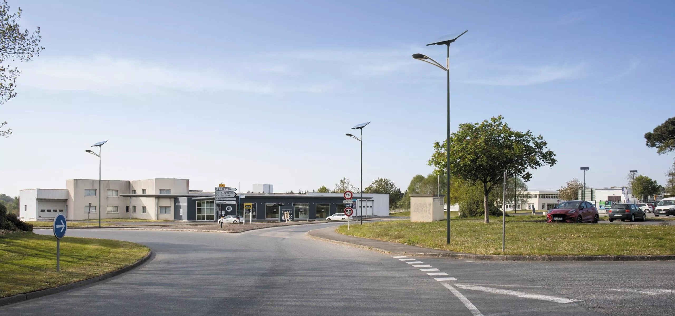 Fonroche NEW ART solar street lights installed along a roadway, featuring geometric diamond-inspired LED luminaires designed for modern urban streets and public spaces.